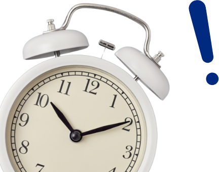 Reloj despertador con un signo de exclamación